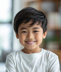 Naklejka premium Young Asian boys in relaxed, casual clothing stand against a plain white background, showcasing their joyful innocence and individual styles.