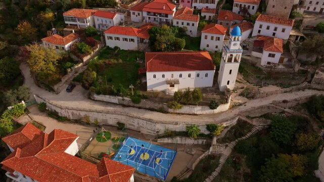 Aerial view of the beautiful medieval village with traditional stone houses and a church, Dhermi, Albania.