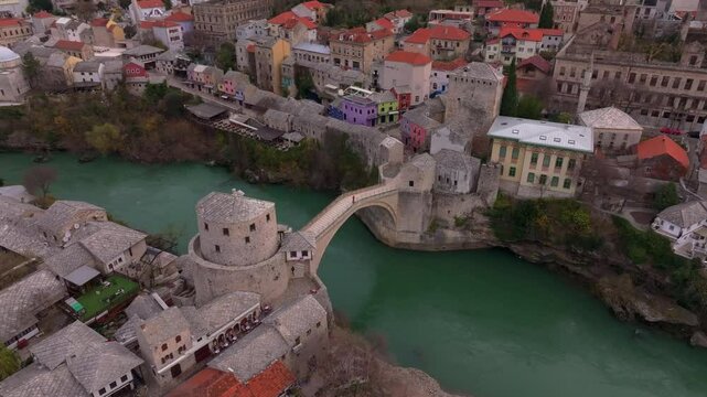 Aerial view of Stari Most bridge over Neretva River at sunrise with historic buildings, Mostar, Bosnia and Herzegovina.