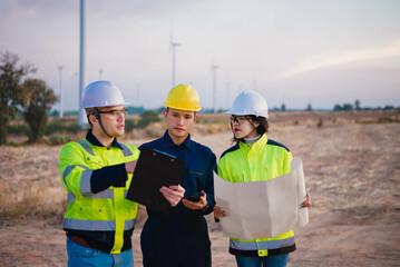 Engineer, technician, and architect met to inspect the area for installing wind turbines to produce renewable energy for the community.