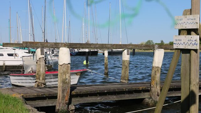 Fishing net gradually covering marina dock view