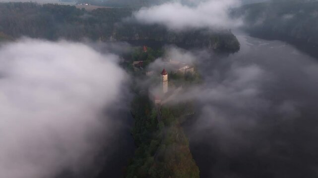 Aerial view of Zvikov Castle and the Moldau river shrouded in fog at sunrise, Zvikovske Podhradi, Czech Republic.