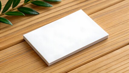 Fototapeta premium Blank White Business Card on Wood Background - Branding Mockup, Professional Design