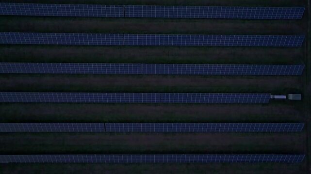 Aerial view of solar farm at sunset with rows of solar panels, Melnik, Czech Republic.