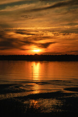 Fototapeta premium Dramatic golden sunset at Ile de Re island near La Rochelle. Charente-Maritime, Nouvelle-Aquitaine, France. Majestic nature, scenic evening landscape background.