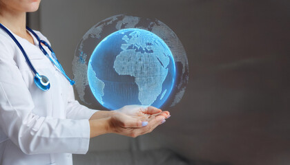Medical professional with holographic globe showing global health care and environmental impact
