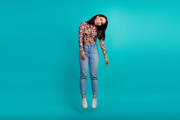 Full body portrait of nice young girl hang air isolated on turquoise color background