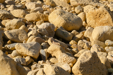 Textured Yellow Limestone Rocks Close-Up for Nature Backgrounds, of natural yellow limestone rocks, perfect for nature, geology, and texture,based designs
