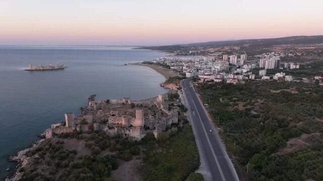 Aerial view of Antik Kiz Kalesi at sunrise overlooking the Mediterranean Sea, Kizkalesi, Turkey.