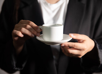 woman hand holding coffee cup