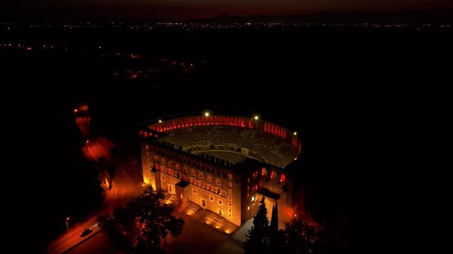 Aerial view of illuminated Aspendos Theatre at night, Serik, Turkey.