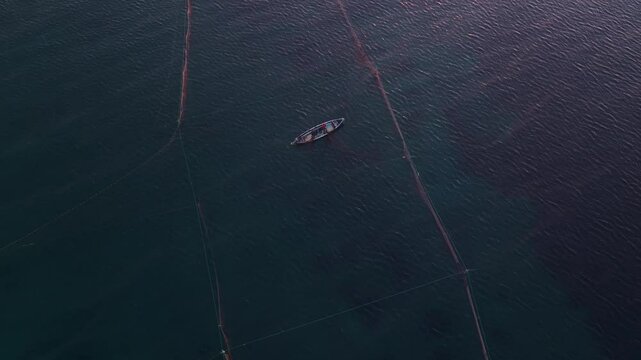 Aerial view of fishing boats on the Aegean Sea at sunrise, Epanomi, Greece.