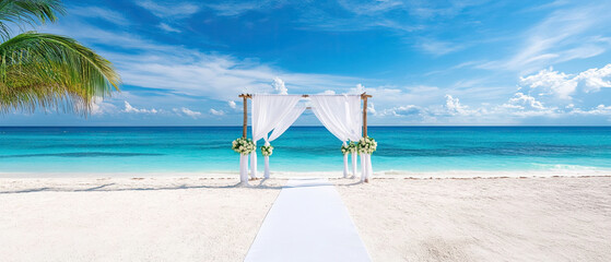 beautiful beach wedding setup with white drapes and flowers