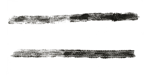 black traces of tractor tires on white background..