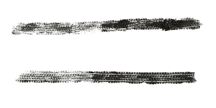 black traces of tractor tires on white background..