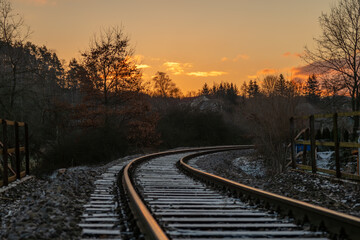 Sunrise and winter snowy landscape near railway from Blatna to Nepomuk