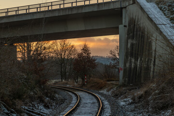 Sunrise and winter snowy landscape near railway from Blatna to Nepomuk