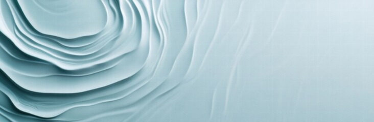 Obraz premium A blue and white background with a wave pattern