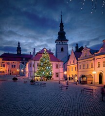 Fototapeta premium View of the pre-Christmas decorated Masaryk Square in Pelhřimov, illuminated Christmas tree