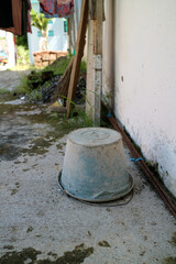 Dirty used cement bucket, upside down outside