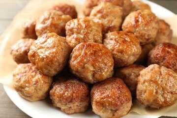 Many delicious meatballs on table, closeup view
