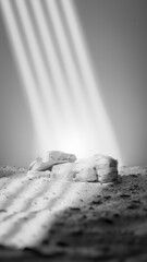 A bottle of perfume is sitting on a rock. The bottle is blue, and the rock is grey premium photo 3d render