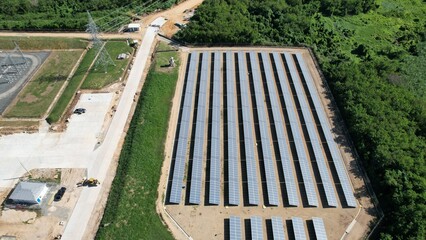 Pv plant seen from drone next to road and vegetation