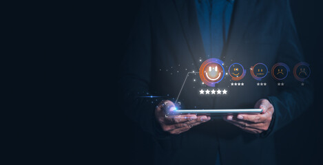 A businessman holds a tablet displaying digital ratings and reviews, emphasizing the importance of feedback and customer satisfaction in a modern, tech-savvy environment. Score satisfaction concept