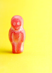 red candy figure stands alone