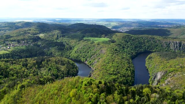 hillside views over woodlands around a horseshoe-shaped meander of the Vltava River at viewport Maj
