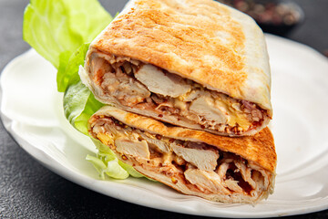 donner kebab chicken and vegetables shawarma sandwich tortilla meat filling fast food flatbread fresh tasty food dish delicious gourmet food background on the table rustic food top view copy space