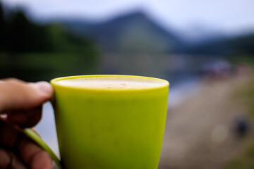 cup of coffee in hand