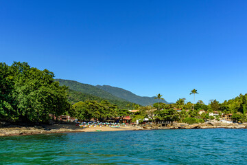 Small beach in the city of Ilhabela on the north coast of Sao Paulo between mountains and vegetation