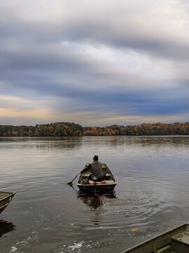 Jon boat on North Carolina lake with autumn trees