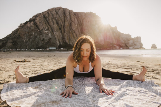 Yoga Teacher Straddle Forward Fold