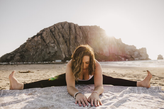 Yoga Teacher Straddle Forward Fold