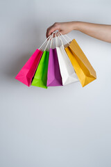 Woman holding in hand shopping package. Paper bag. Sale in store. Customer buy present. Black friday sale. Holiday special offer, discount. Female in market