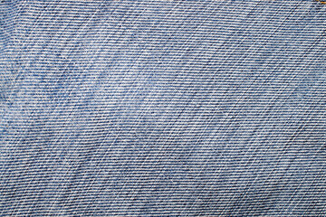 Separate fragments of good old jeans, macro, top view.