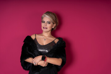 Fototapeta premium Confident mature woman in evening wear posing with elegance and style