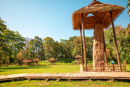 Mayan stelae inside the Quirigu&aacute; archaeological park, protected by a structure made of organic materials.