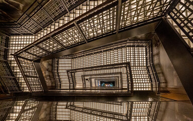 View of beautiful lighted staircase with mesmerizing reflections and intricate architecture, Ginza, Tokyo Metropolis, Japan.