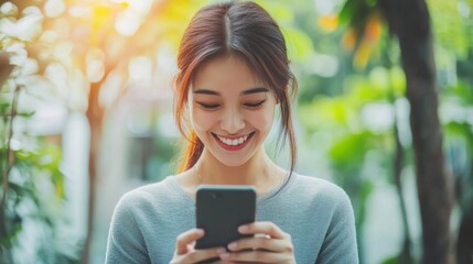 Smiling Woman Using Smartphone Outdoors