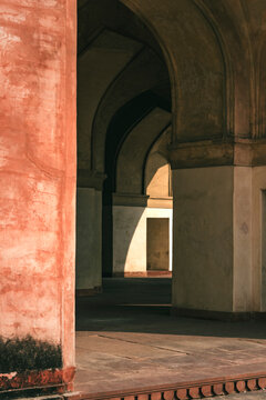 View of the beautiful tomb of Akbar with elegant arches and columns, Agra, India.
