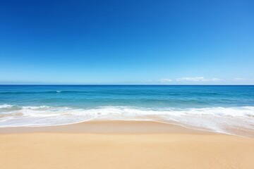 Golden sand dunes seamlessly flow into the ocean, showcasing the striking contrast between the arid desert and the refreshing sea under a clear blue sky