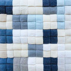 Fototapeta premium A textured pattern of carefully arranged soft squares in soothing color tones.