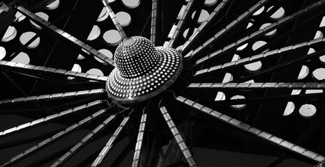 Carnival thrill spinning amusement park fast speed ride wheel close up