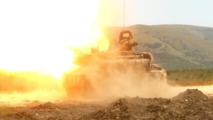 heavy tank fires a gun in battle