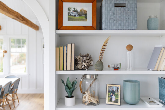 Modern Cottage home shelf decor with feather and frame photo 