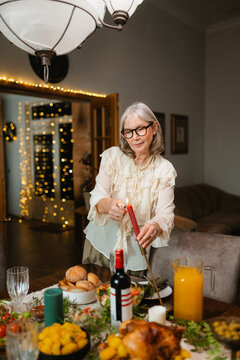 A woman sets the table