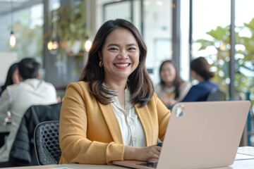 Professional woman engaged in a meeting, collaborating on ideas with a laptop, focusing on teamwork, project planning, and constructive feedback